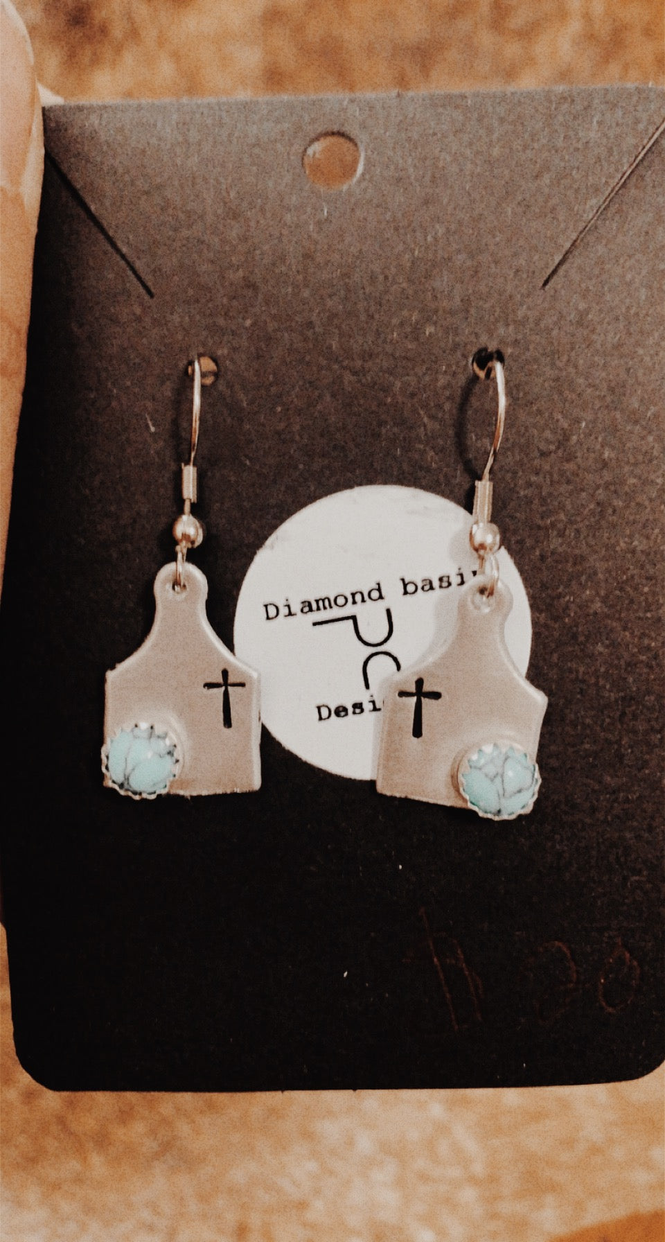 Cross cow tag earrings