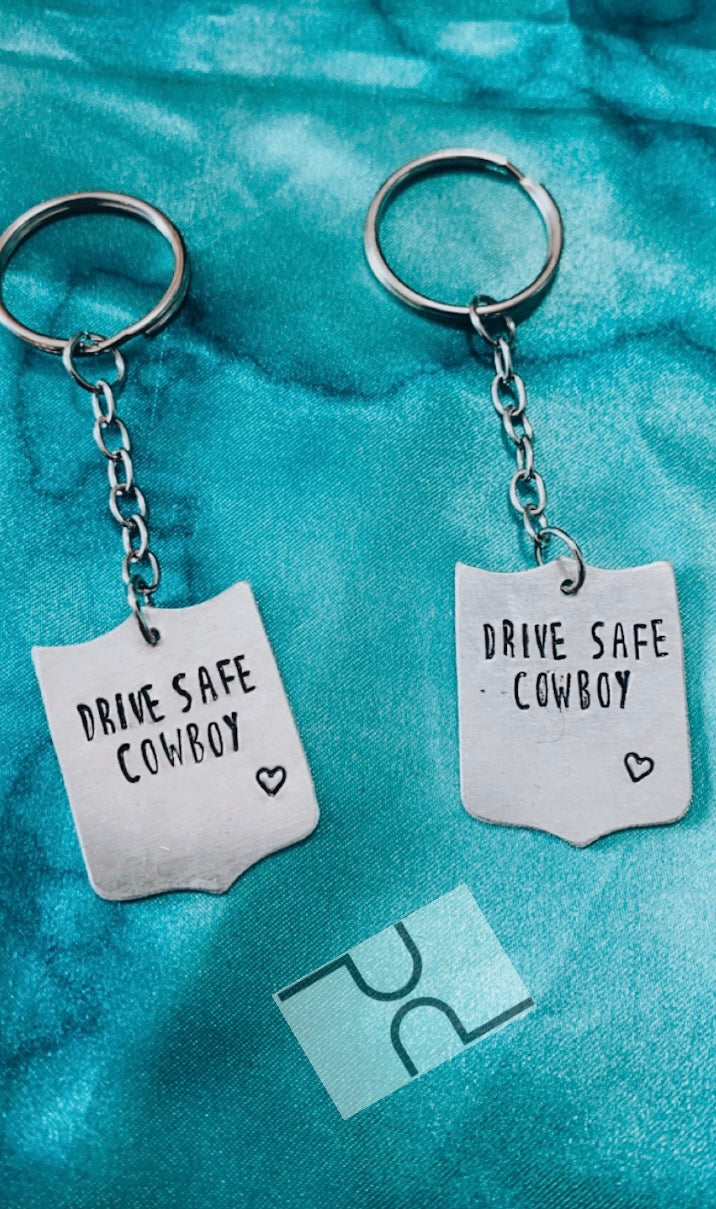 Drive safe cowboy keychain